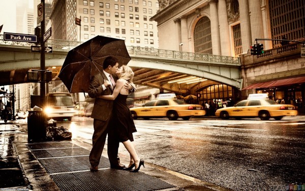 Couple engaged in love in rain wallpaper