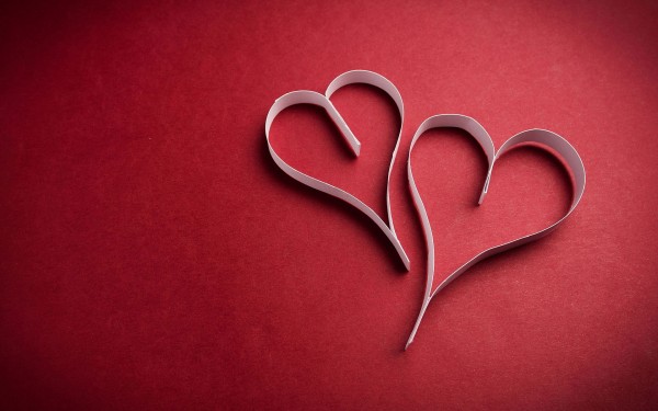 Love wallpapers of two paper hearts on red background